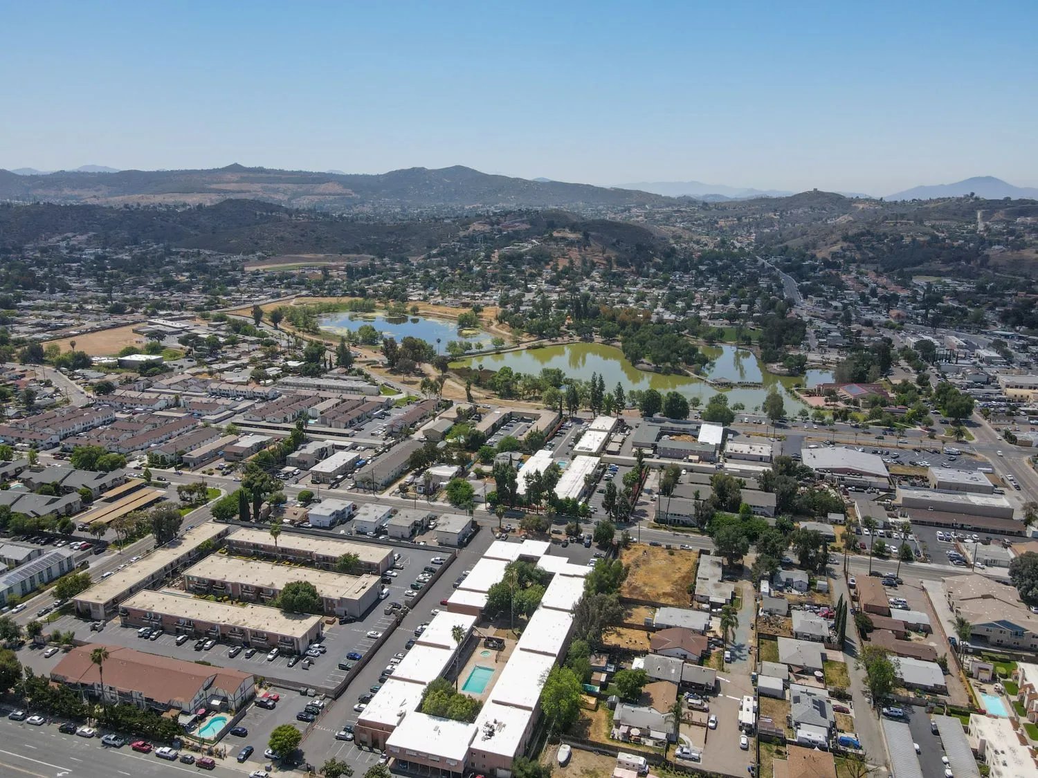 Aerial view over Lakeside, California, with Lindo Lake among neighbourhoods and the hills of East San Diego County behind.
